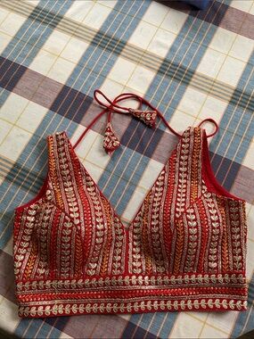 Red Embroidered Sleeveless Blouse with Silver Accents